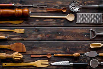 Frame of cookware for chef work on wooden background top view space for text