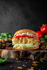 Tasty grilled burger with chicken, turkey, or breaded fish fillets.  Delicious grilled hamburger on...