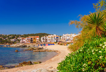 Fototapeta na wymiar Sea landscape with Calella de Palafrugell, Catalonia, Spain near of Barcelona. Scenic fisherman village with nice sand beach and clear blue water in nice bay. Famous tourist destination in Costa Brava