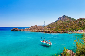 Sea skyview landscape photo Ladiko bay near Anthony Quinn bay on Rhodes island, Dodecanese, Greece. Panorama with nice sand beach and clear blue water. Famous tourist destination in South Europe
