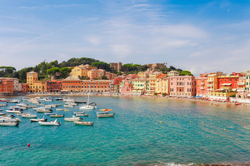 Fototapeta na wymiar Sea aerial landscape in Sestri Levante, Liguria, Italy. Scenic fishing village with traditional houses and clear blue water. Summer vacation rich resort with picturesque harbour and nice sand beach