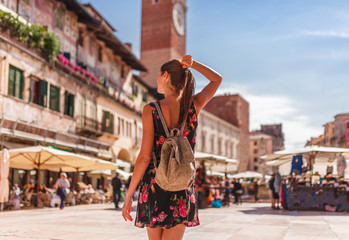 Toirust woman in Verona near old market in historical center. Traveler in famous travel destination...