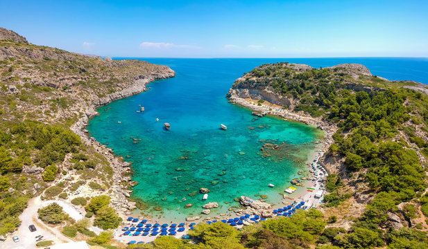 Aerial birds eye view drone photo Anthony Quinn near Ladiko bay on Rhodes island, Dodecanese, Greece. Panorama with nice lagoon and clear blue water. Famous tourist destination in South Europe