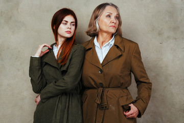 two women in red coats