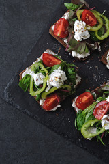 Healthy keto toast with mix salad, vegetables and white cheese.