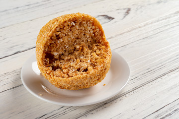 traditional Chinese fried sesame ball on white wood table