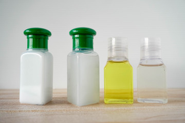 shower gel and syampoo on wooden background