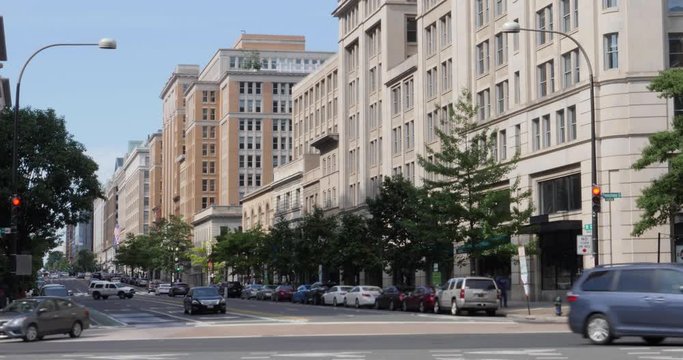 A daytime exterior establishing shot of a typical Washington, D.C. street.  	