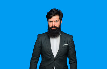 Serious businessman in suit. Business, people and office concept. Serious confident businessman. Businessman in stylish clothes. Handsome leader CEO boss portrait. Executive business man at workspace.