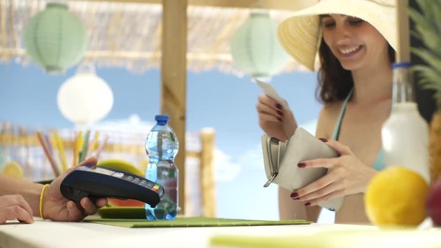 Woman paying with a contactless credit card
