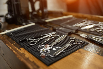 Vintage tools of barber shop on wooden background