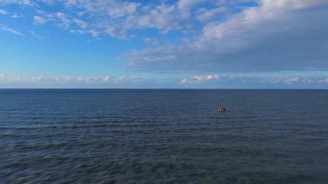BEAUTIFUL BLUE SEA AND CLOUDY SKY FROM THE AIR