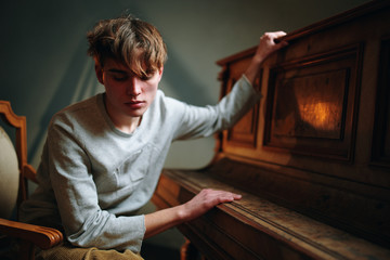 man sitting in front of fireplace