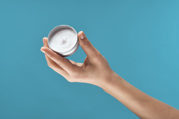 hand holding a glass isolated on white background