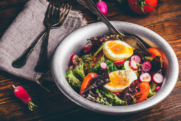 Fresh spring salad with homegrown vegetables and boiled eggs