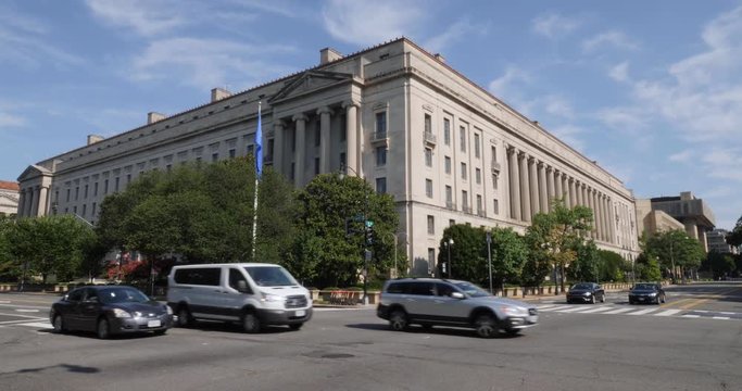 Daytime establishing shot of the Department of Justice Building in downtown Washington, D.C.
