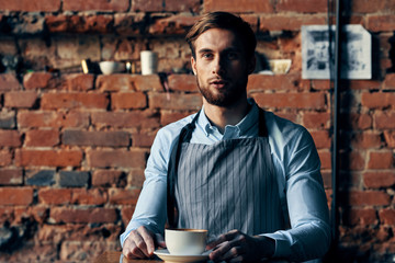 young man with cup of coffee