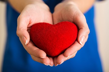 Closeup of a Woman Holding a Heart