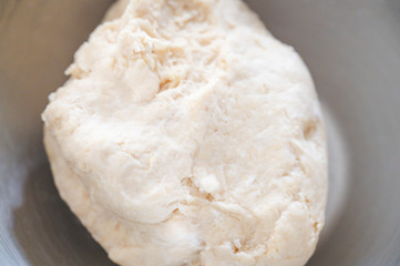 Close-up raw caramelized crisps dough in stainless steel tray.The popular traditional thai dessert.