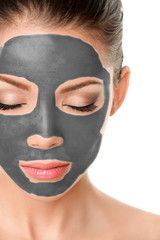 Volcanic clay mask facial treatment asian beauty woman putting mud product on skin for healthy skincare therapy.