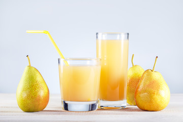 Pear Juice with fresh fruits on wooden table. Healthy food and drink.