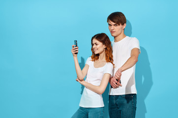 young couple painting wall