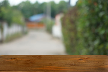 Empty dark wooden table in front of abstract blurred bokeh background of restaurant . can be used for display or montage your products.Mock up for space.