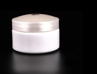 The Beauty Cream Containers on Black Background