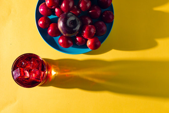 Red drink near fresh fruits