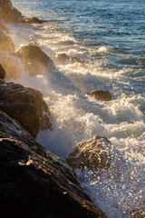 Splashing water from touching of strong wave on rocks