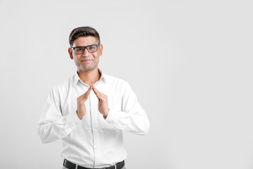 Young Man showing Home gesture with hand 