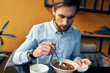 man eating breakfast in the kitchen