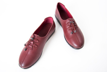 Pair of women leather shoes isolated on white background