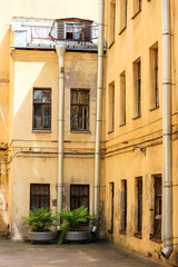 Cosy old building with the flowerpots in the yard in Saint Petersburg, Russia