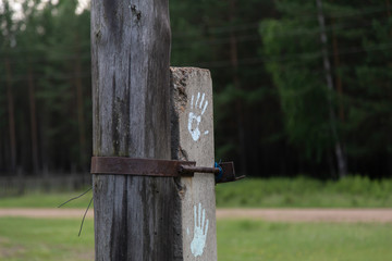 a pillar which depicts the paint of people's palms