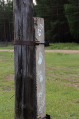 a pillar which depicts the paint of people's palms