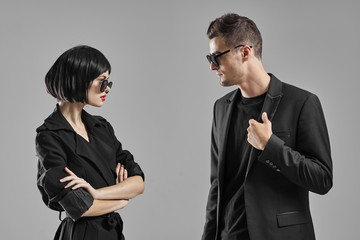 man and woman fighting over white background