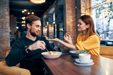 young couple having dinner in restaurant