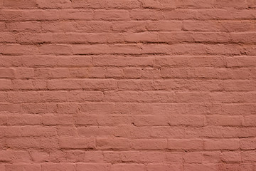 Antique old shabby chic brick wall texture background, bearing several layers of reddish brown paint