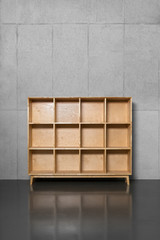 a wooden bookshelf where books are empty.