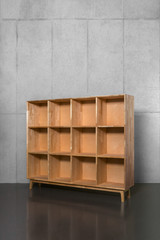 a wooden bookshelf where books are empty.