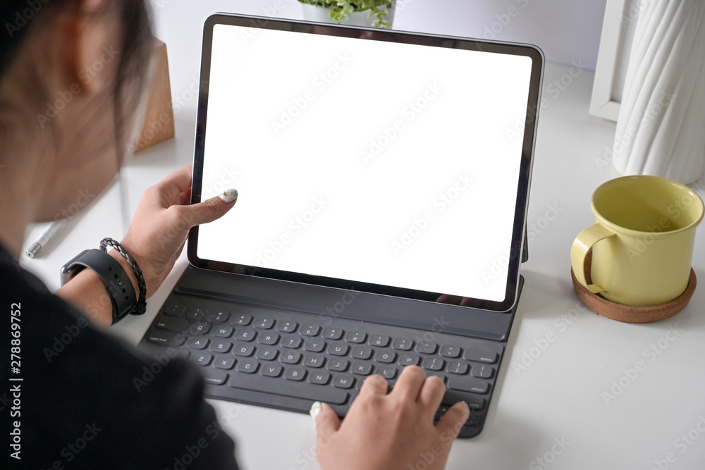 Fototapete woman freelancer is working on tablet computer with blank copy space screen for your advertising gra