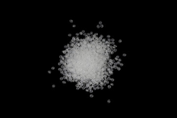 Concept Natural plastics Love the world. Polymer pellets Isolated on black background. Innovation natural plastic.