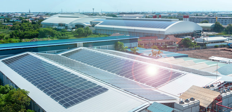  Solar panels or Solar cells on factory rooftop or terrace with sun light, Industry.