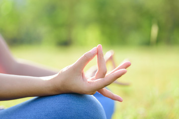 Close up hand, woman yoga and meditation in outdoor