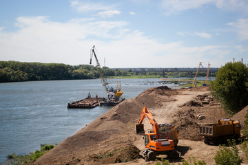 extraction of sand from the river on the ship and its transportation