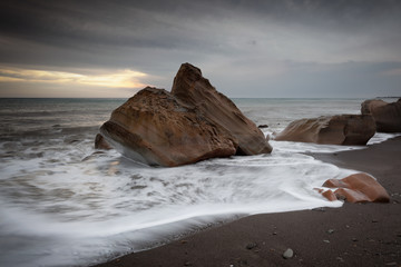 Rocks on a Beach on a Stormy Day