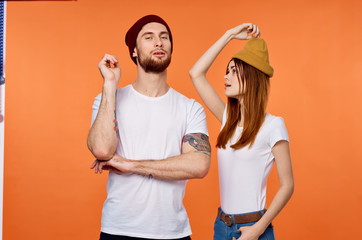 couple painting wall with paint roller