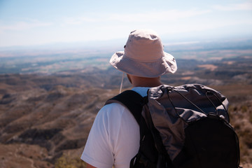 Fototapeta na wymiar backpacker traveler with hat and white shirt