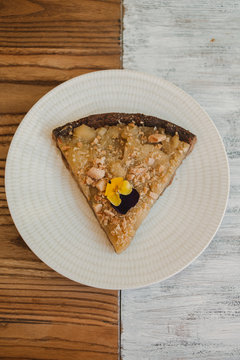 From above tasty appetizing cake festively decorated with bright flowers